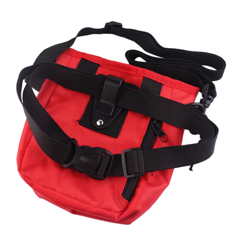 Back view of the red treat pouch showing the adjustable belt strap and clip system
