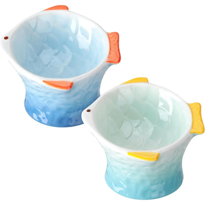 Ceramic fish-shape elevated cat feeder, front view showing the tilted fish-shaped bowl design